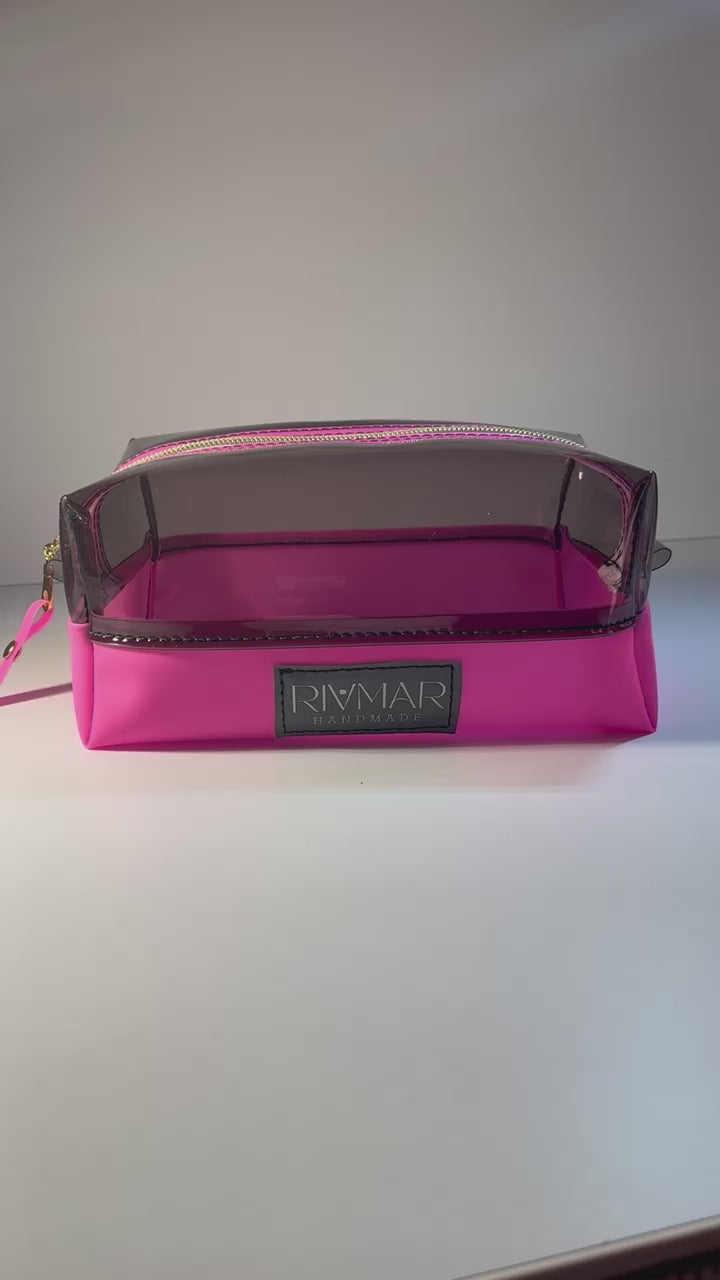 Beautiful - Boxy (Vinyl) Pouch Bags with plenty of room to store your Makeup, Cosmetic, Toiletry or Traveling neccessities.   Available in Light Blue and Hot Pink with a white and gold Nylon Zipper.     IN STOCK !! / READY TO SHIP  (5-10 Business Days)